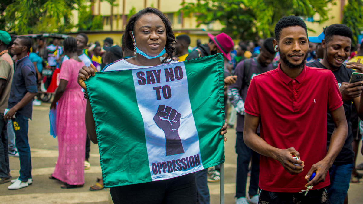 A woman holds a flag with 